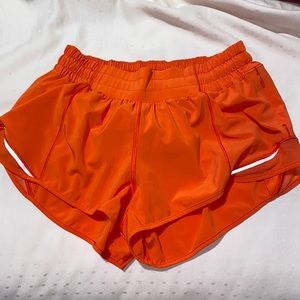 Bright Orange Lulu Lemon Hotty Hot Shorts 2.5’